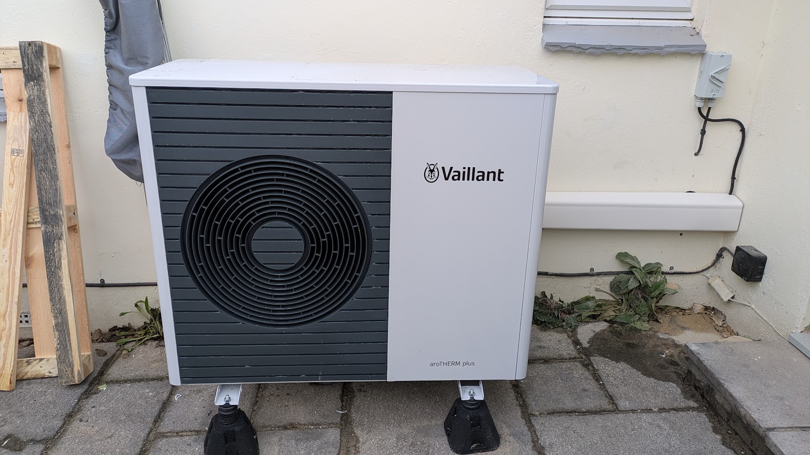 A Vaillant aroTHERM plus air source heat pump installed against the wall — MCS-certified, with the £7,500 grant handled.